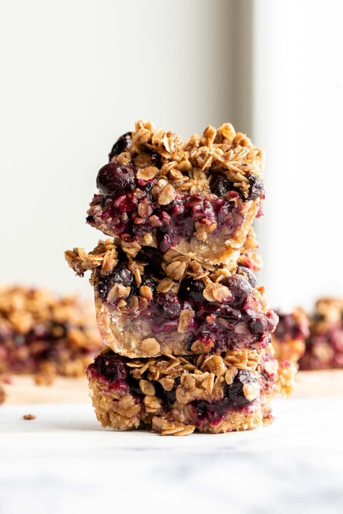 Blueberry oat squares are sweet, buttery, and delicious, with three mouthwatering layers. With just 15 minutes of prep, they are the perfect treat. | aheadofthyme.com