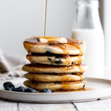 There’s nothing better in the morning than thick, soft, fluffy blueberry pancakes, loaded with fresh berries, topped with butter, and soaked in maple syrup. | aheadofthyme.com