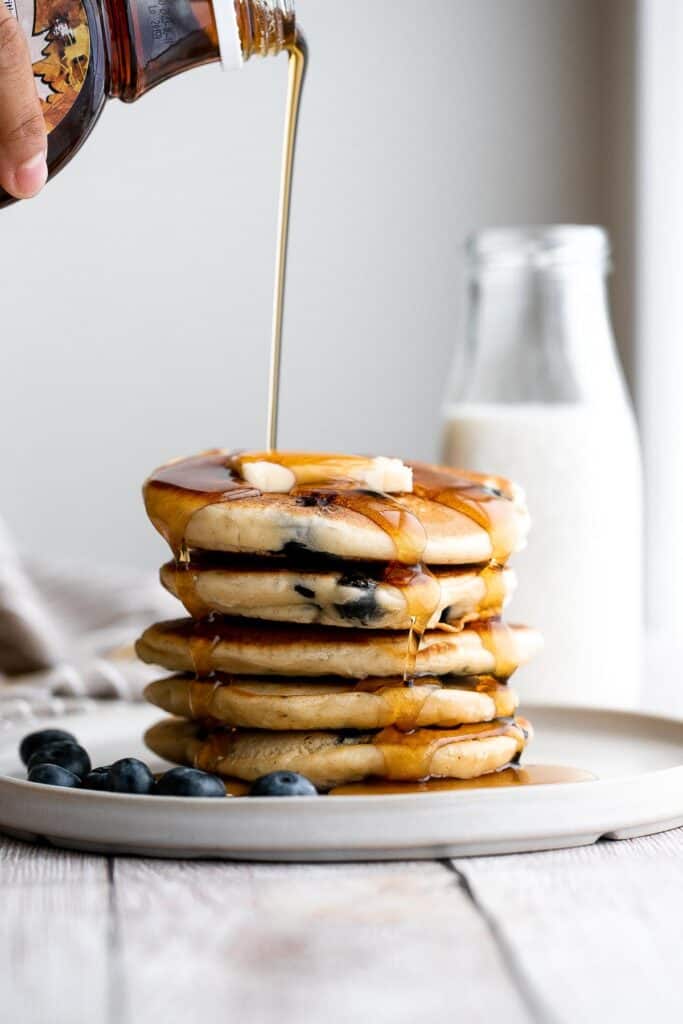 There’s nothing better in the morning than thick, soft, fluffy blueberry pancakes, loaded with fresh berries, topped with butter, and soaked in maple syrup. | aheadofthyme.com