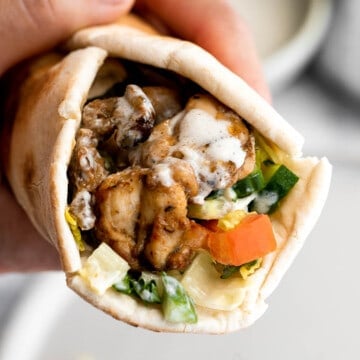 Homemade chicken shawarma (donair) with juicy tender chicken marinated in Middle Eastern spices and wrapped in pita bread is easy to make at home. | aheadofthyme.com