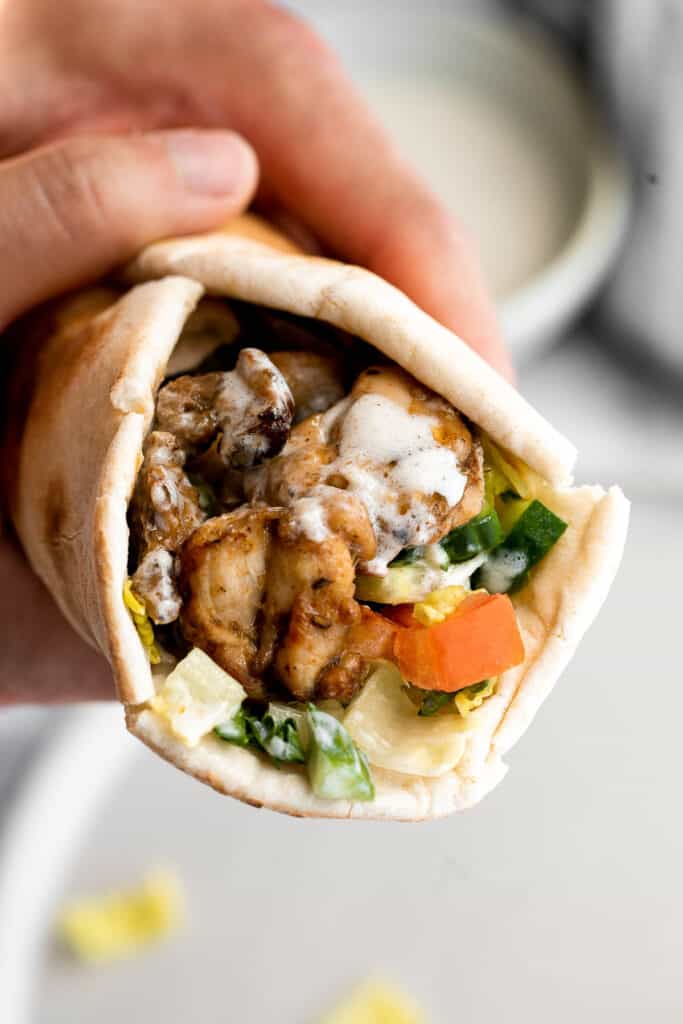 Homemade chicken shawarma (donair) with juicy tender chicken marinated in Middle Eastern spices and wrapped in pita bread is easy to make at home. | aheadofthyme.com