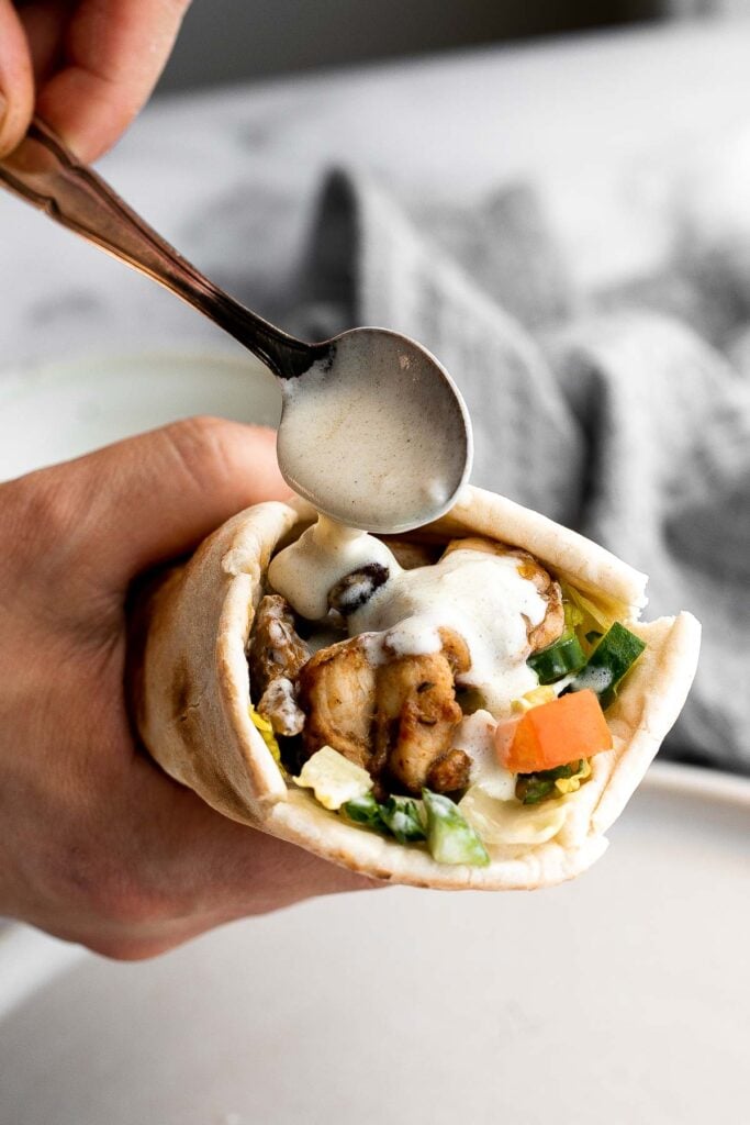 Homemade chicken shawarma (donair) with juicy tender chicken marinated in Middle Eastern spices and wrapped in pita bread is easy to make at home. | aheadofthyme.com