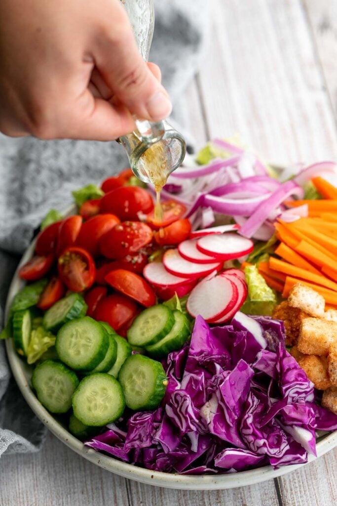 Quick easy homemade garden salad is simple and delicious. Ready in minutes, it's loaded with crisp leafy greens, fresh garden veggies, and crunchy croutons. | aheadofthyme.com