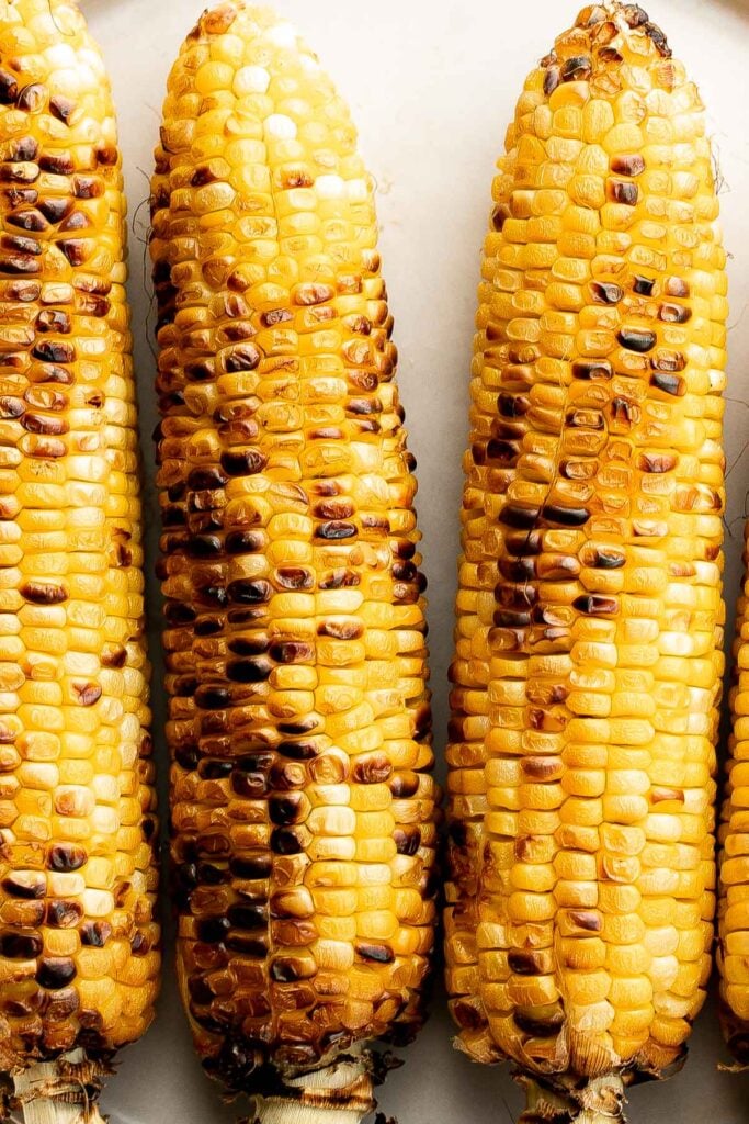 Buttery and salty grilled corn on the cob with beautiful char marks, delicious flavor, and the best texture is the easiest recipe to throw on the grill. | aheadofthyme.com