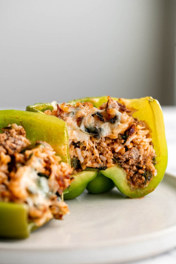 Ground beef stuffed peppers are delicious, healthy, and filling. Stuffed with beef rice and veggies, they're easy to make ahead and freezer-friendly. | aheadofthyme.com