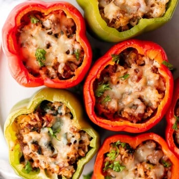 Ground beef stuffed peppers are delicious, healthy, and filling. Stuffed with beef rice and veggies, they're easy to make ahead and freezer-friendly. | aheadofthyme.com