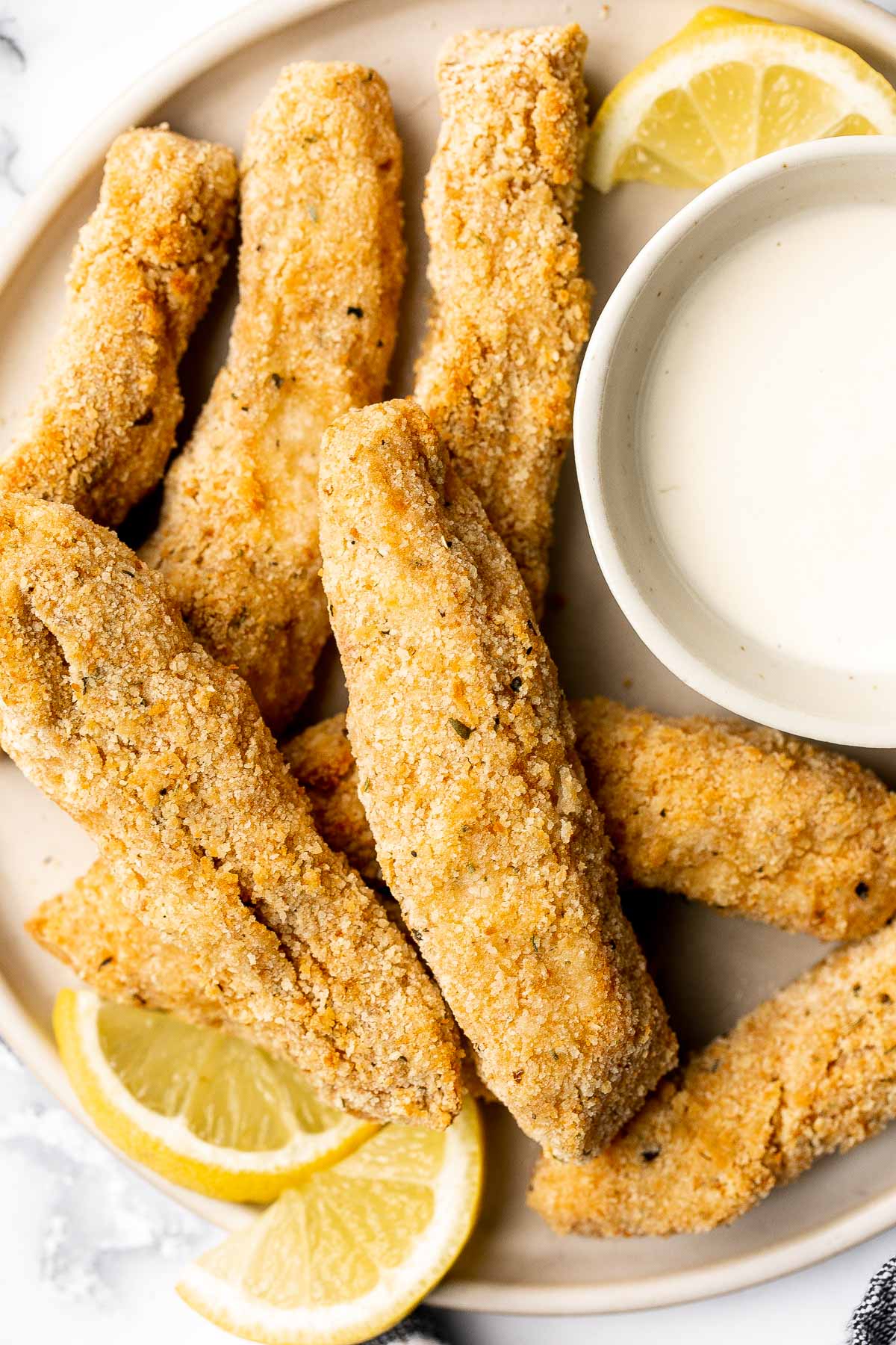 Quick easy baked homemade fish sticks are crispy on the outside, tender and flaky on the inside, and packed with flavor. Kid-friendly + freezer-friendly. | aheadofthyme.com