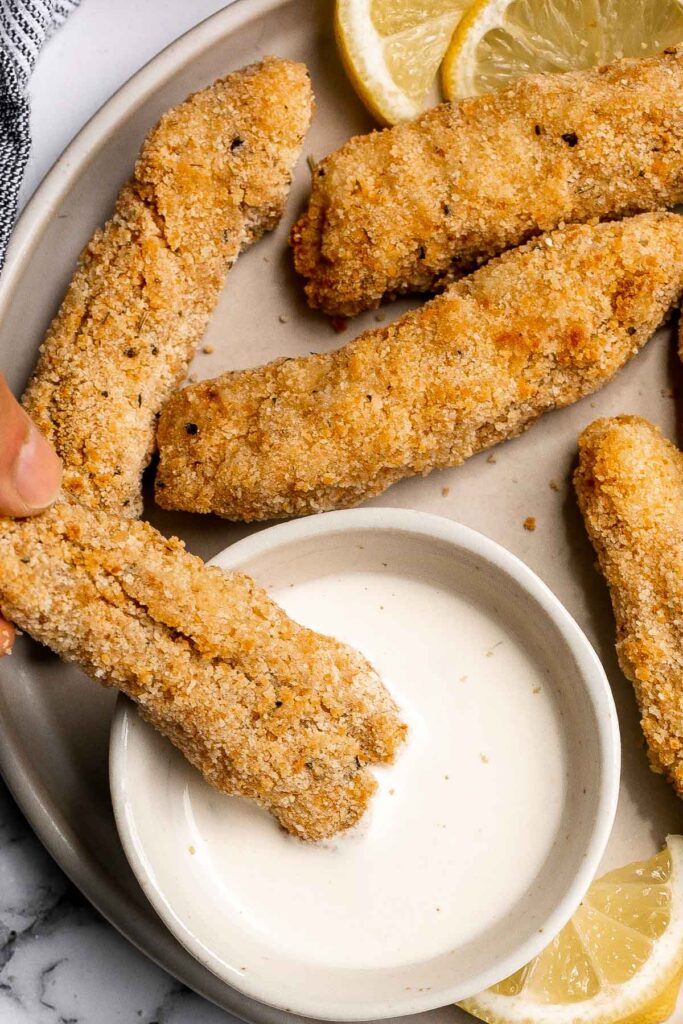 Quick easy baked homemade fish sticks are crispy on the outside, tender and flaky on the inside, and packed with flavor. Kid-friendly + freezer-friendly. | aheadofthyme.com