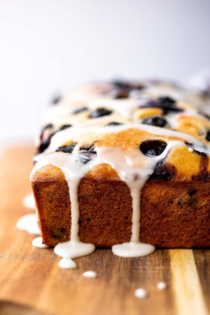 Easy lemon blueberry bread with lemon glaze is soft, moist, and delicious. This quick bread with fresh blueberries and lemon is the perfect summer dessert. | aheadofthyme.com