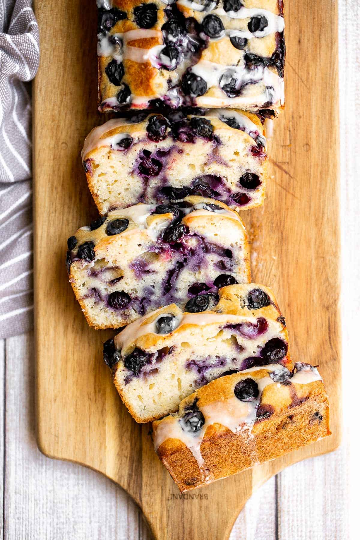 Easy lemon blueberry bread with lemon glaze is soft, moist, and delicious. This quick bread with fresh blueberries and lemon is the perfect summer dessert. | aheadofthyme.com