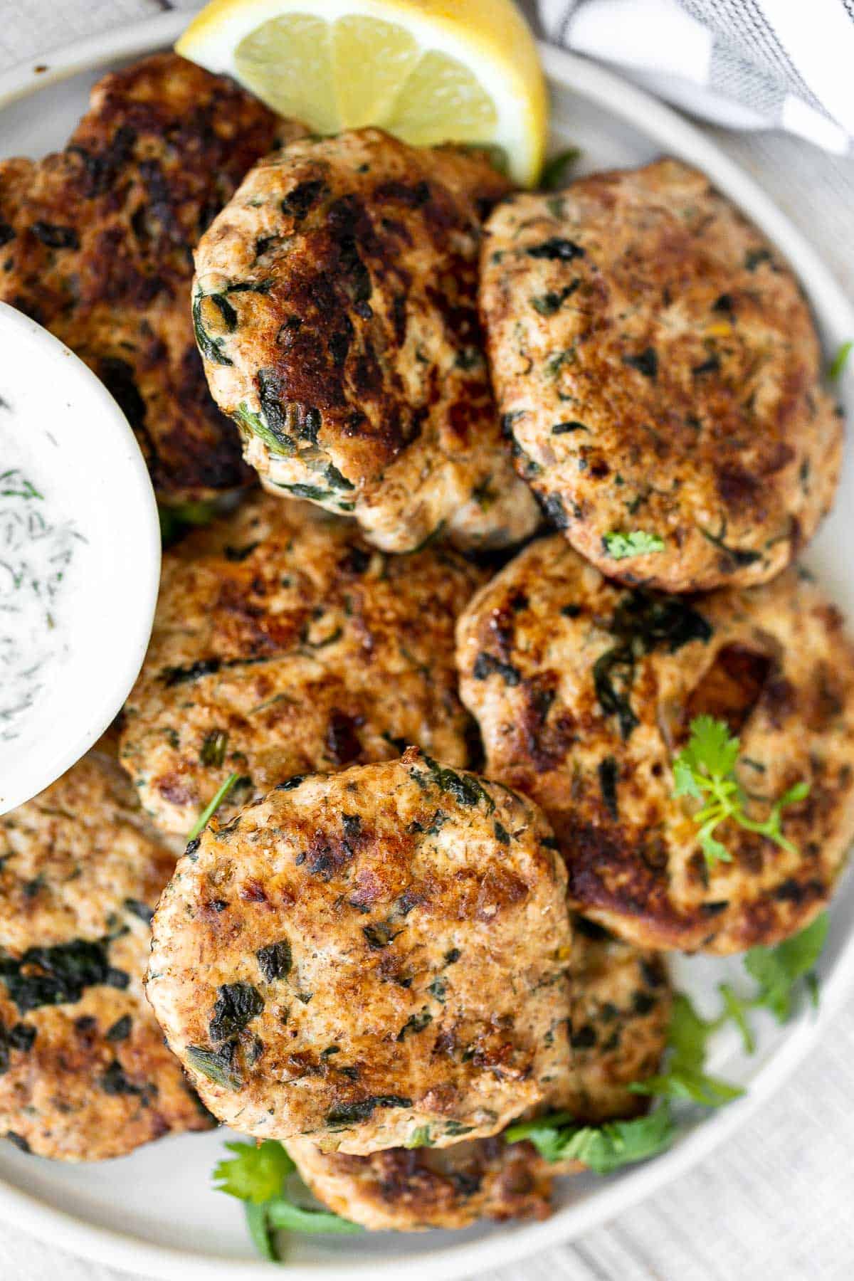 Delicious, moist and juicy Mediterranean chicken patties have everything you want in one bite: protein, veggies, herbs, and they're quick and easy to make. | aheadofthyme.com