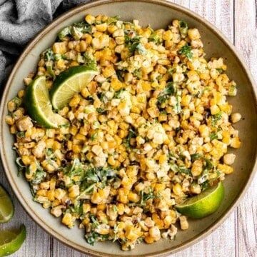 Mexican street corn salad adds a twist to a classic street food, loaded with freshly grilled corn, a creamy cheesy dressing, and authentic flavor. | aheadofthyme.com