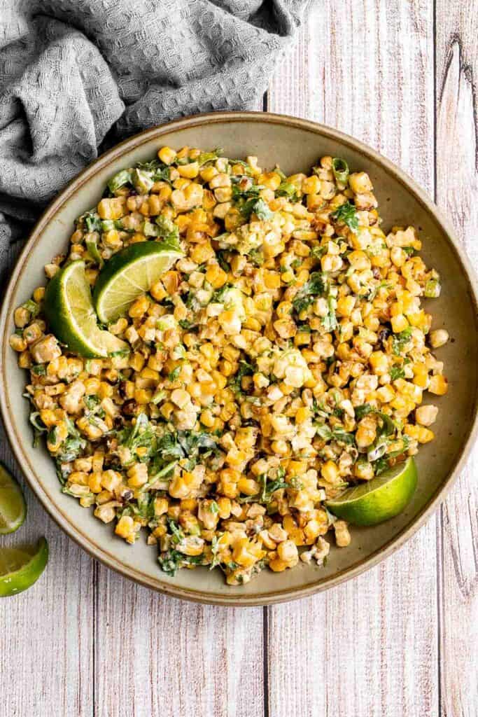 Mexican street corn salad adds a twist to a classic street food, loaded with freshly grilled corn, a creamy cheesy dressing, and authentic flavor. | aheadofthyme.com