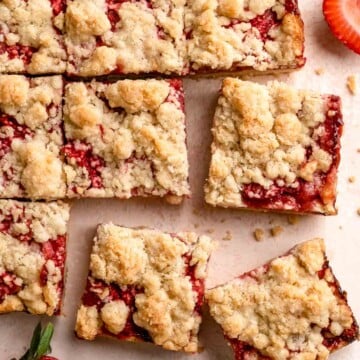 Strawberry Crumb Bars are sweet, savory, and tart homemade bars made with a layer of jammy strawberries sandwiched between two crumbly pastry layers. | aheadofthyme.com