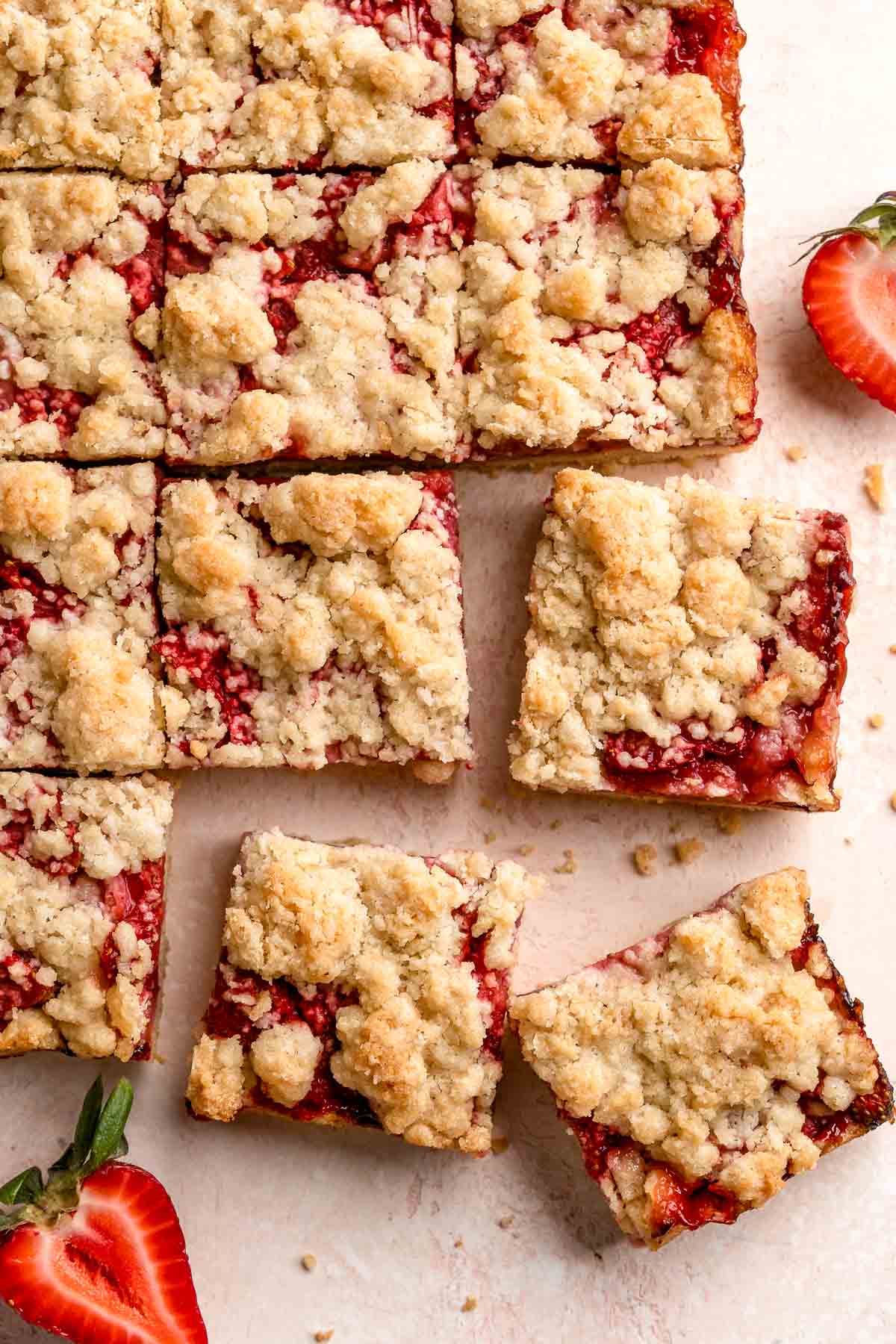 Strawberry Crumb Bars are sweet, savory, and tart homemade bars made with a layer of jammy strawberries sandwiched between two crumbly pastry layers. | aheadofthyme.com