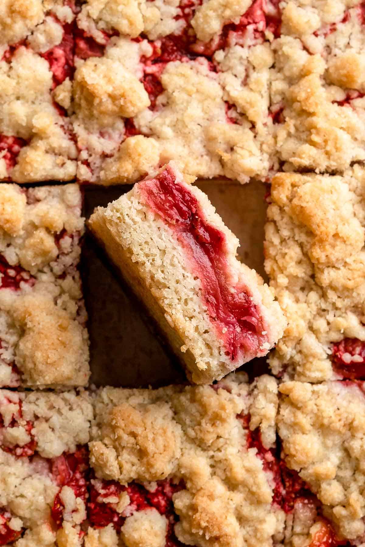Strawberry Crumb Bars are sweet, savory, and tart homemade bars made with a layer of jammy strawberries sandwiched between two crumbly pastry layers. | aheadofthyme.com