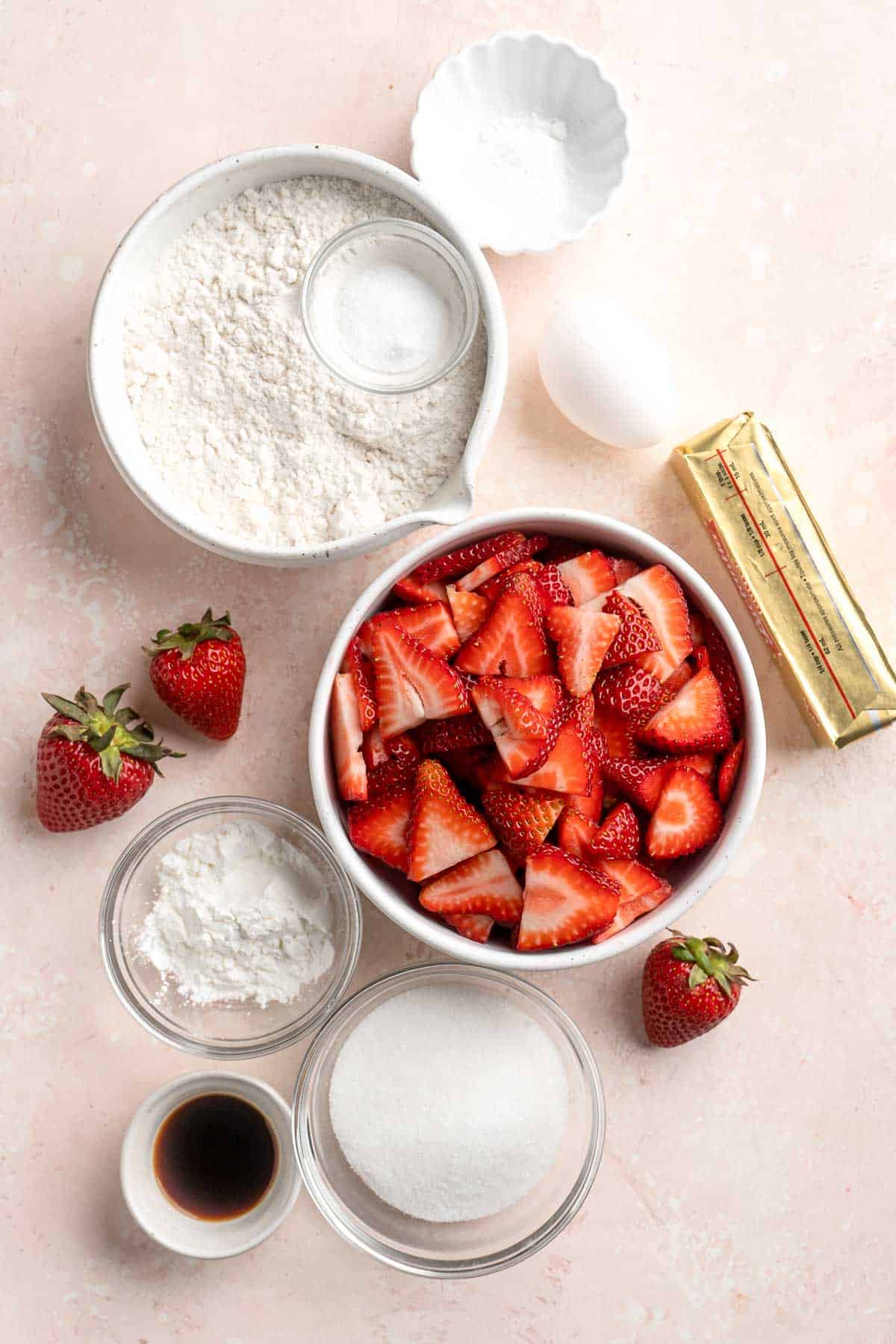 Strawberry Crumb Bars are sweet, savory, and tart homemade bars made with a layer of jammy strawberries sandwiched between two crumbly pastry layers. | aheadofthyme.com