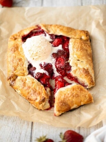 Easier than pie, this strawberry galette with a buttery flaky crust and a sweet and tart strawberry filling is a beautiful treat to serve this berry season. | aheadofthyme.com