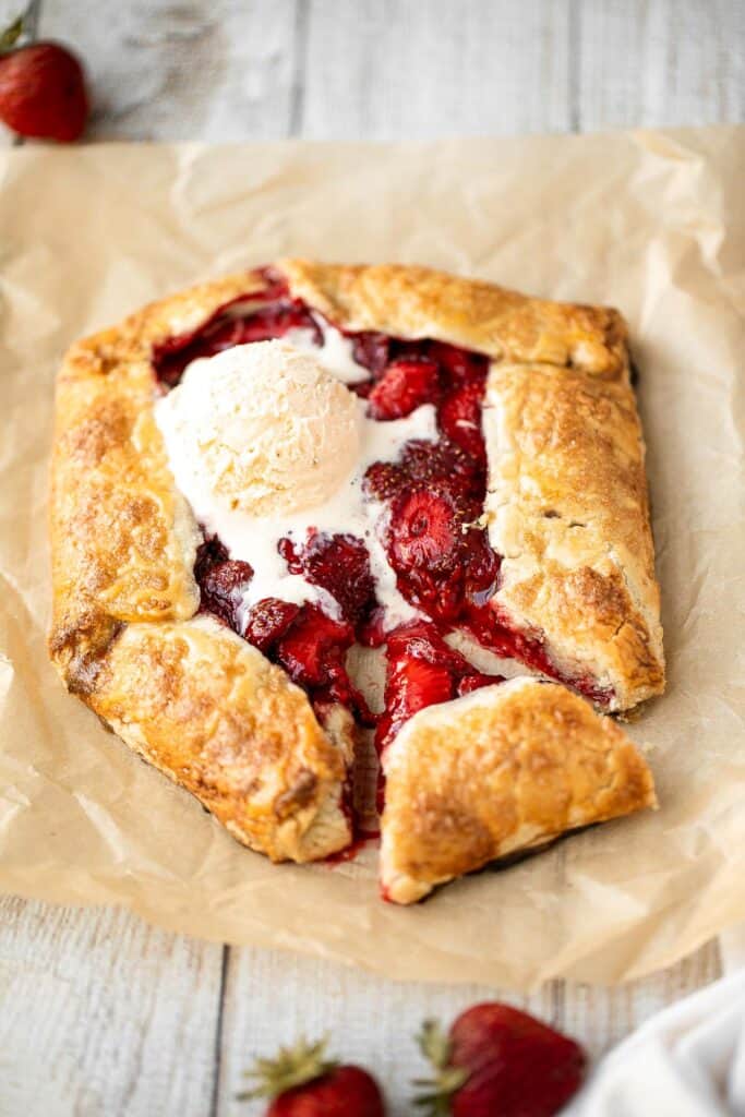 Easier than pie, this strawberry galette with a buttery flaky crust and a sweet and tart strawberry filling is a beautiful treat to serve this berry season. | aheadofthyme.com