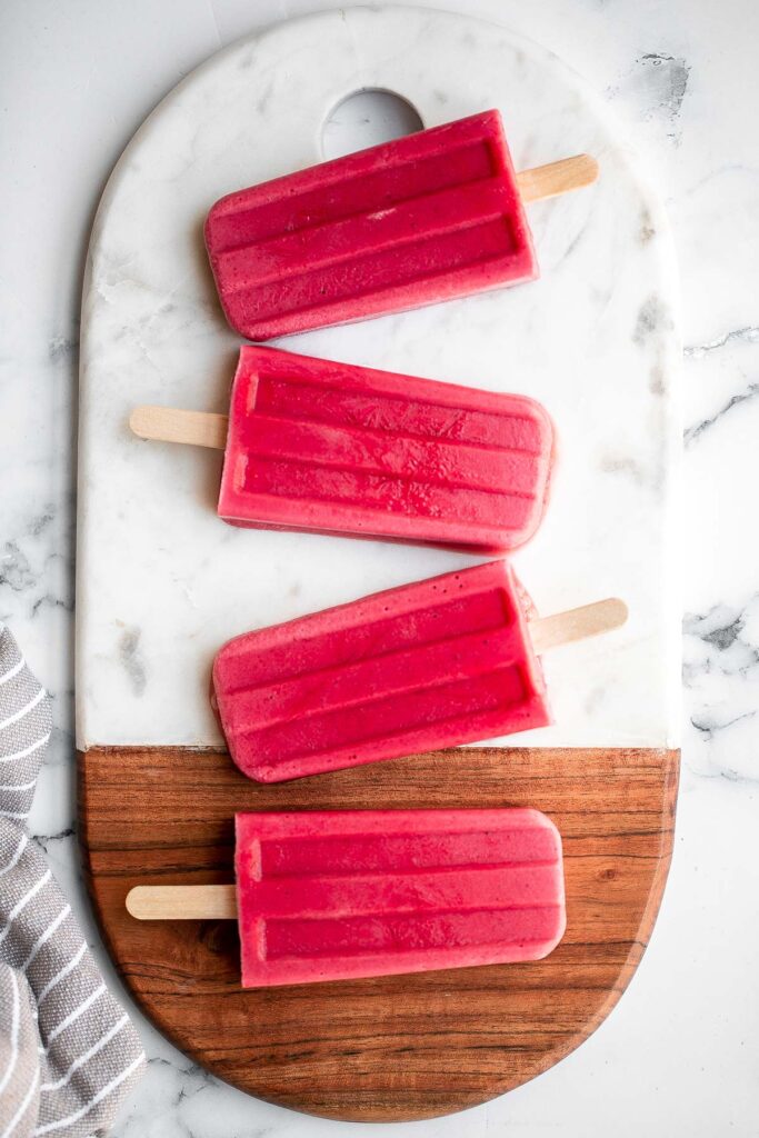 Homemade strawberry popsicles are healthy, refreshing, and sweet. Made with just 4 ingredients, they're packed with fresh strawberries and no refined sugar. | aheadofthyme.com