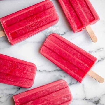 Homemade strawberry popsicles are healthy, refreshing, and sweet. Made with just 4 ingredients, they're packed with fresh strawberries and no refined sugar. | aheadofthyme.com