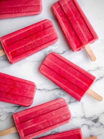 Homemade strawberry popsicles are healthy, refreshing, and sweet. Made with just 4 ingredients, they're packed with fresh strawberries and no refined sugar. | aheadofthyme.com