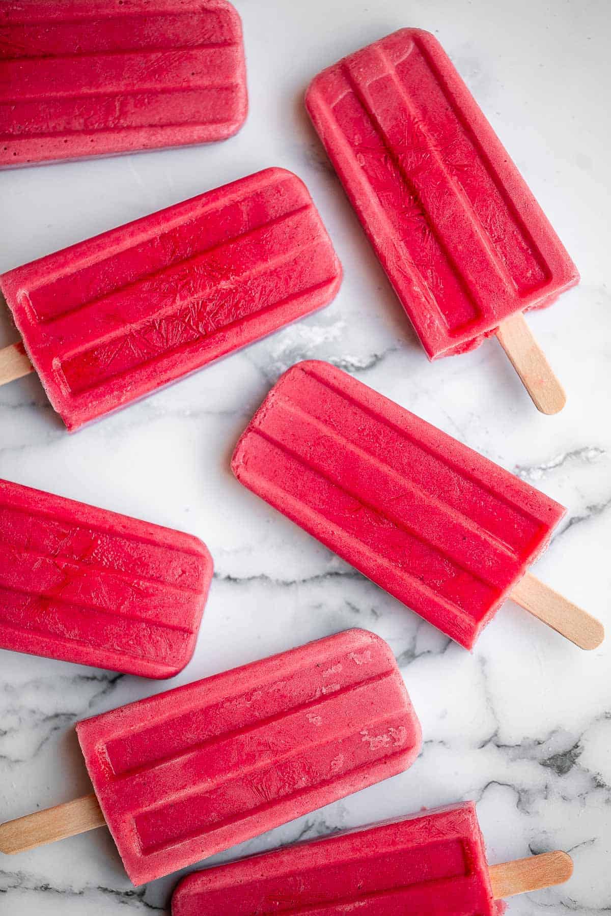 Homemade strawberry popsicles are healthy, refreshing, and sweet. Made with just 4 ingredients, they're packed with fresh strawberries and no refined sugar. | aheadofthyme.com