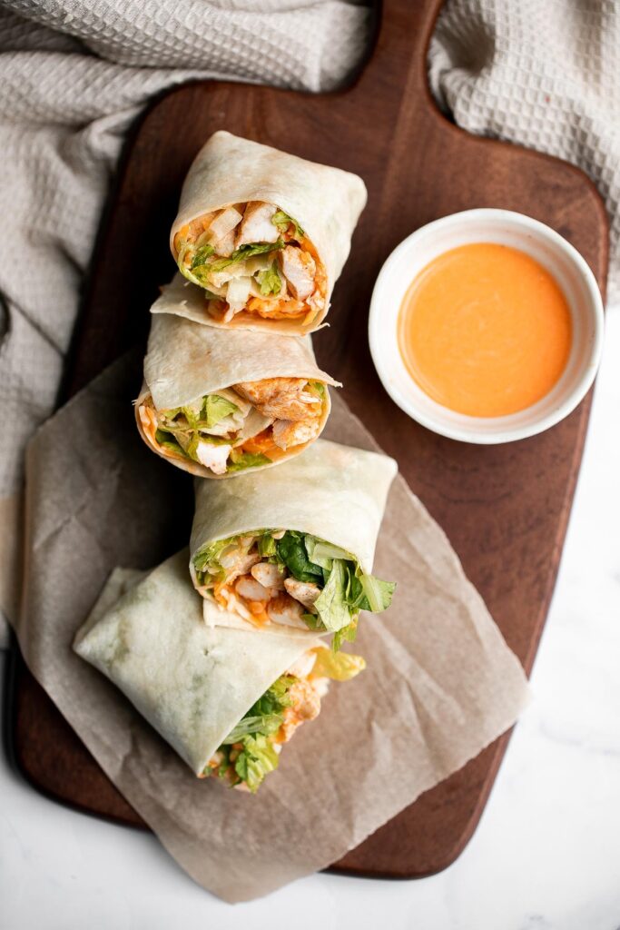 Quick easy buffalo turkey wraps with homemade buffalo sauce are flavorful, spicy, and delicious. A healthy lunch that will keep you full until dinner. | aheadofthyme.com