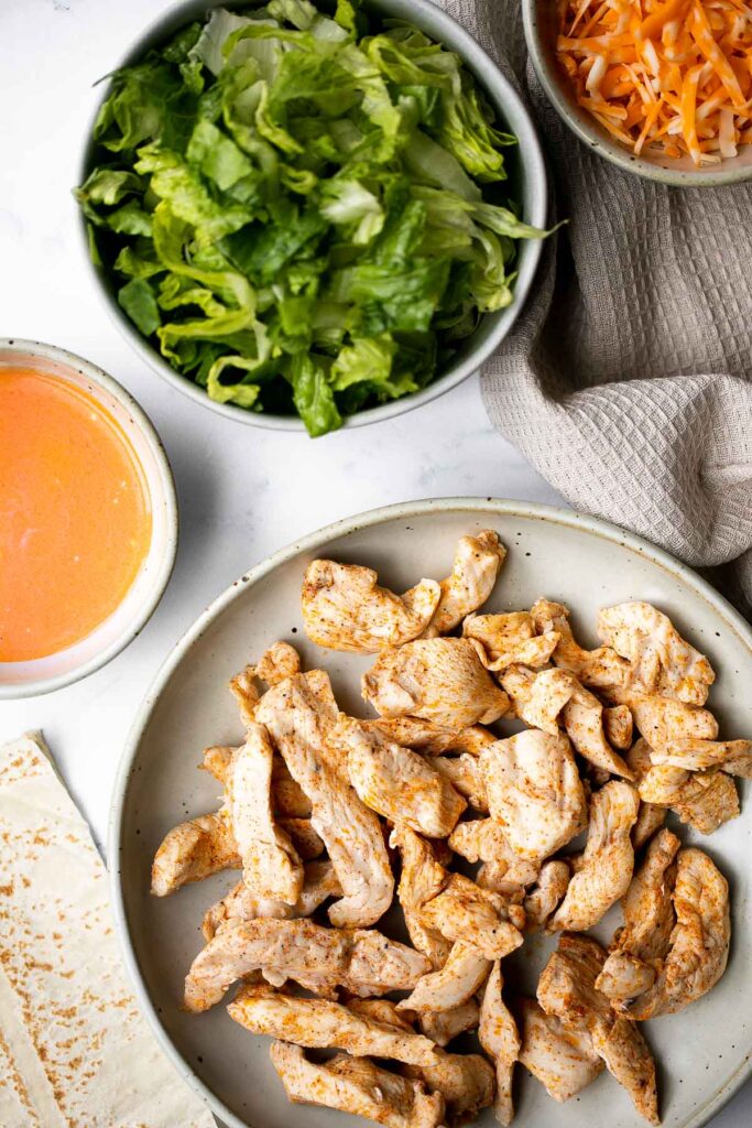 Quick easy buffalo turkey wraps with homemade buffalo sauce are flavorful, spicy, and delicious. A healthy lunch that will keep you full until dinner. | aheadofthyme.com