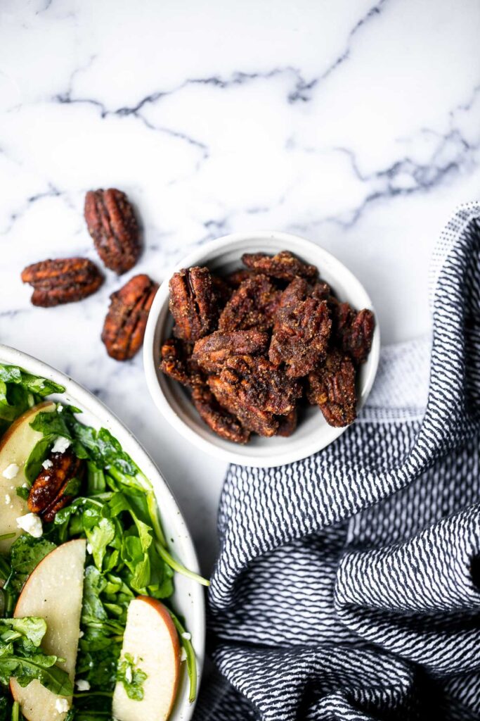 Candied pecans are a delicious, crunchy, and sweet snack during the holidays or great topped on salads and more. Made with five pantry staple in 10 minutes. | aheadofthyme.com