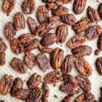 Candied pecans are a delicious, crunchy, and sweet snack during the holidays or great topped on salads and more. Made with five pantry staple in 10 minutes. | aheadofthyme.com