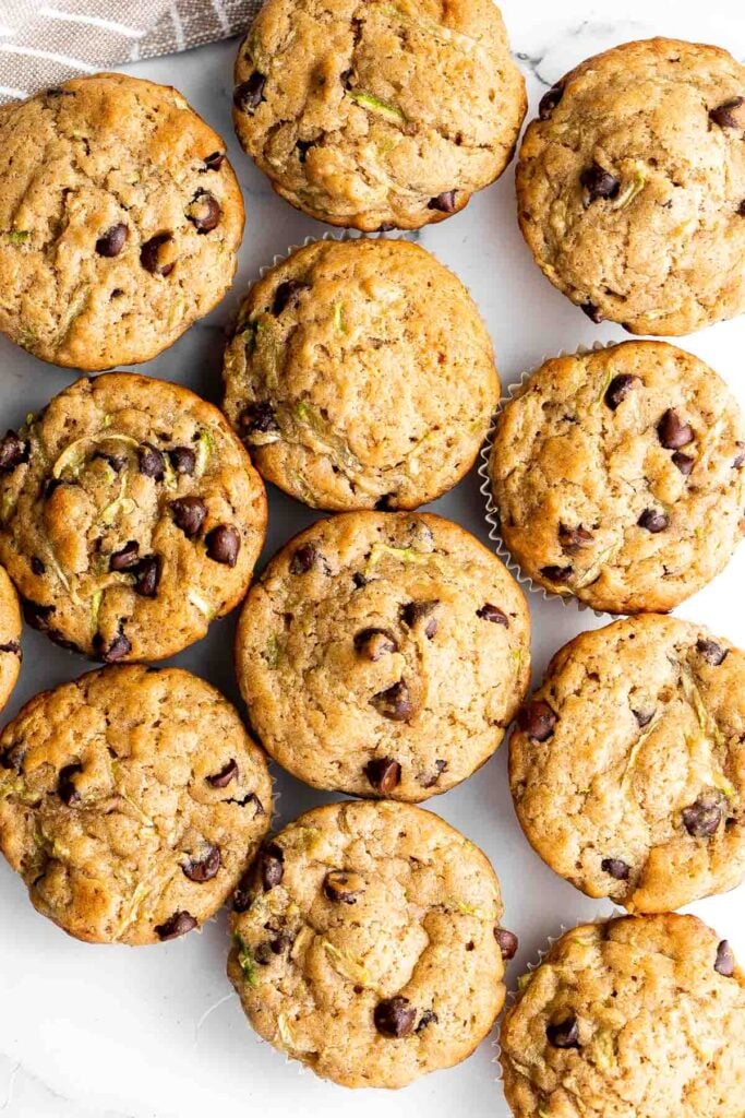 Chocolate chip zucchini muffins are moist, fluffy, and delicious. They are made healthier with fresh zucchini and yogurt which also adds amazing texture. | aheadofthyme.com