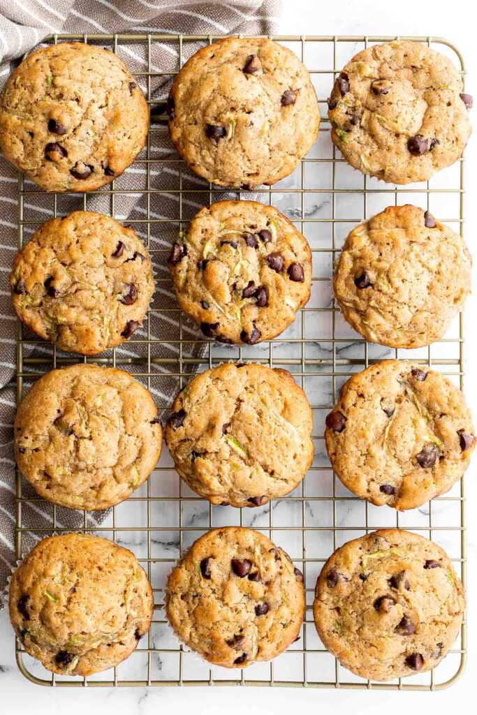 Chocolate chip zucchini muffins are moist, fluffy, and delicious. They are made healthier with fresh zucchini and yogurt which also adds amazing texture. | aheadofthyme.com