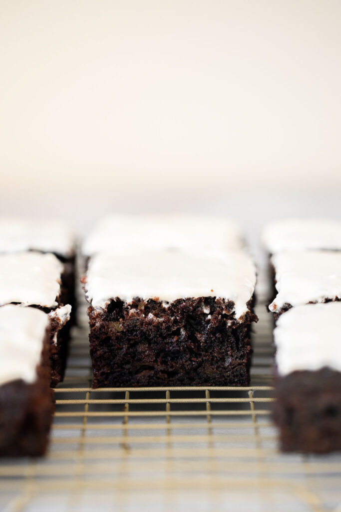 Chocolate zucchini cake is moist, fluffy, and delicious. Loaded with fresh zucchini for a burst of nutrition, and topped with a homemade cream cheese icing. | aheadofthyme.com