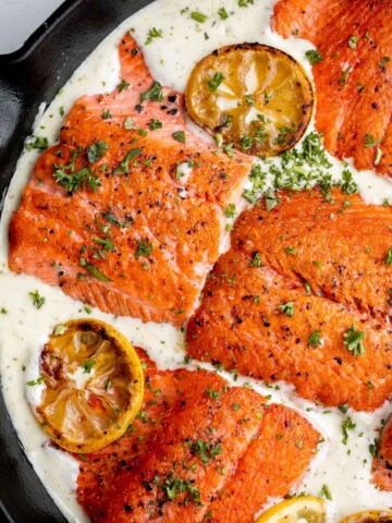 Creamy garlic salmon is a quick easy one-pan meal ready in under 30 minutes, with seared flaky tender salmon tossed in a delicious creamy garlic sauce. | aheadofthyme.com