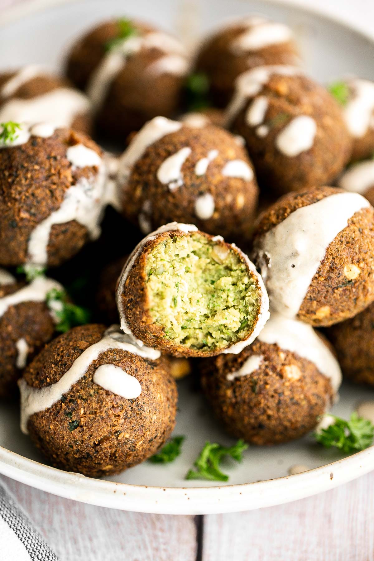 Homemade falafel are delicious, golden brown and crispy on the outside, fluffy tender and soft inside. Plus, they're vegan, loaded with plant-based protein. | aheadofthyme.com