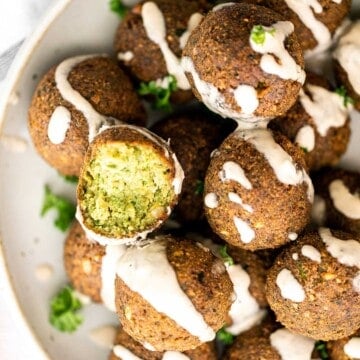 Homemade falafel are delicious, golden brown and crispy on the outside, fluffy tender and soft inside. Plus, they're vegan, loaded with plant-based protein. | aheadofthyme.com