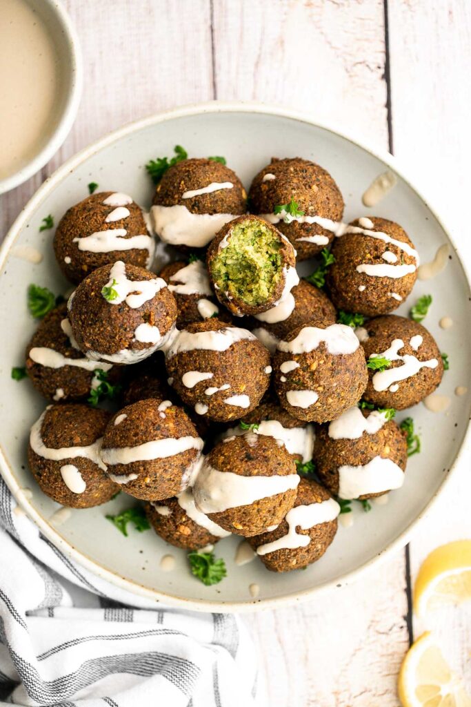 Homemade falafel are delicious, golden brown and crispy on the outside, fluffy tender and soft inside. Plus, they're vegan, loaded with plant-based protein. | aheadofthyme.com