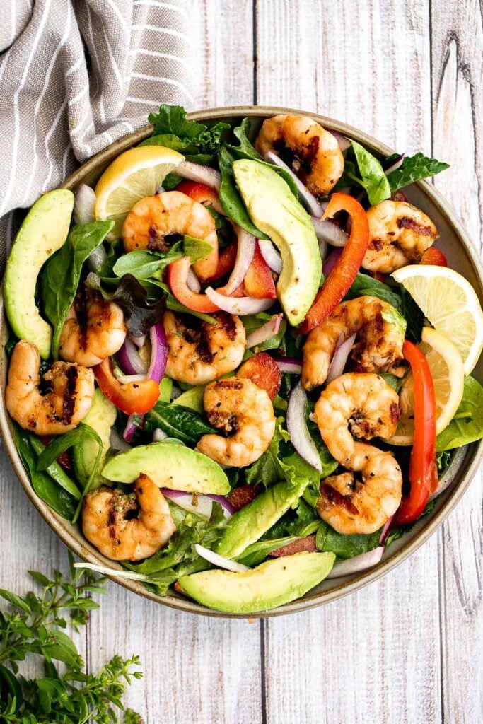 Grilled shrimp salad is a quick and easy, healthy summer meal that is loaded with fresh, flavorful ingredients, all tossed in an easy homemade dressing. | aheadofthyme.com