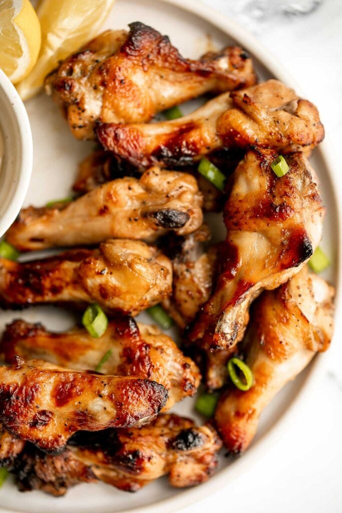 Honey mustard chicken wings are crispy on the outside but juicy and tender inside. Baked in an air fryer or oven, they have the best texture and flavor. | aheadofthyme.com