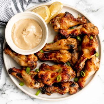 Honey mustard chicken wings are crispy on the outside but juicy and tender inside. Baked in an air fryer or oven, they have the best texture and flavor. | aheadofthyme.com
