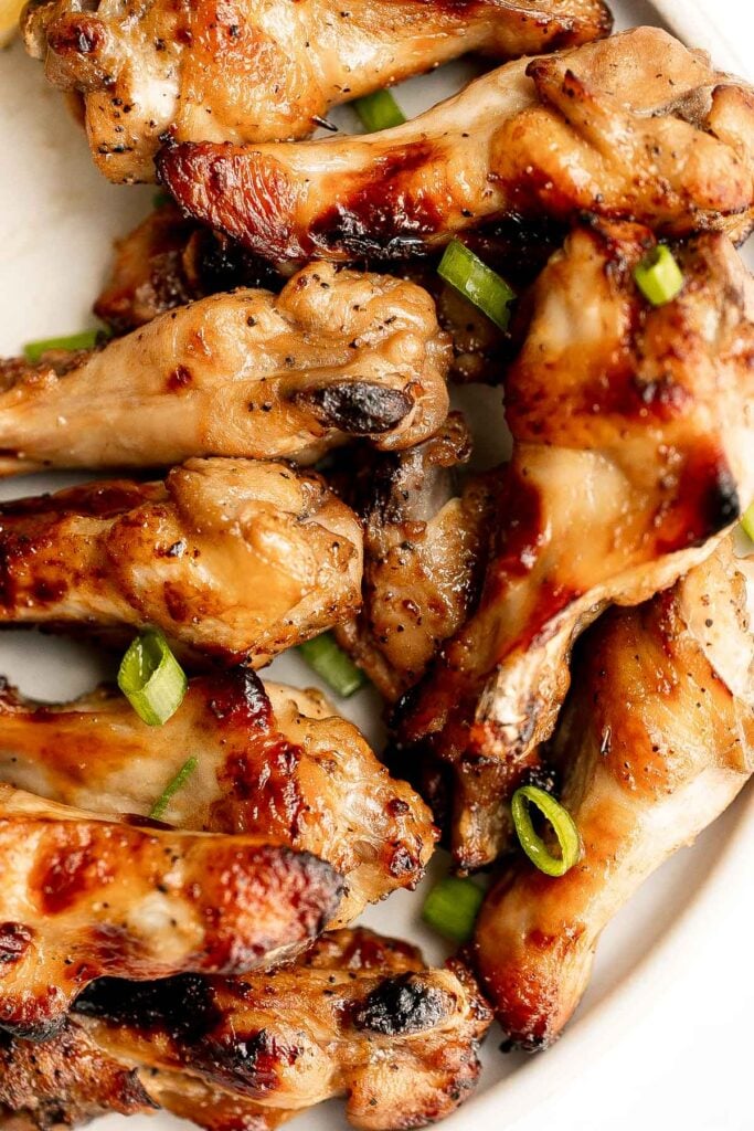 Honey mustard chicken wings are crispy on the outside but juicy and tender inside. Baked in an air fryer or oven, they have the best texture and flavor. | aheadofthyme.com