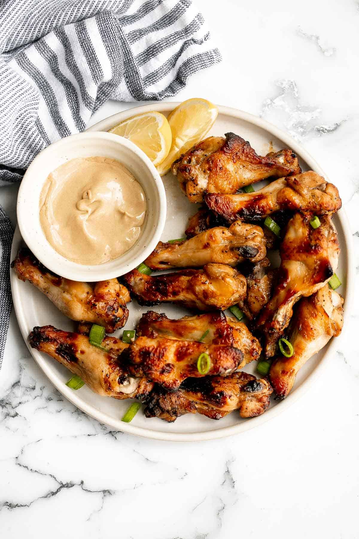 Honey mustard chicken wings are crispy on the outside but juicy and tender inside. Baked in an air fryer or oven, they have the best texture and flavor. | aheadofthyme.com