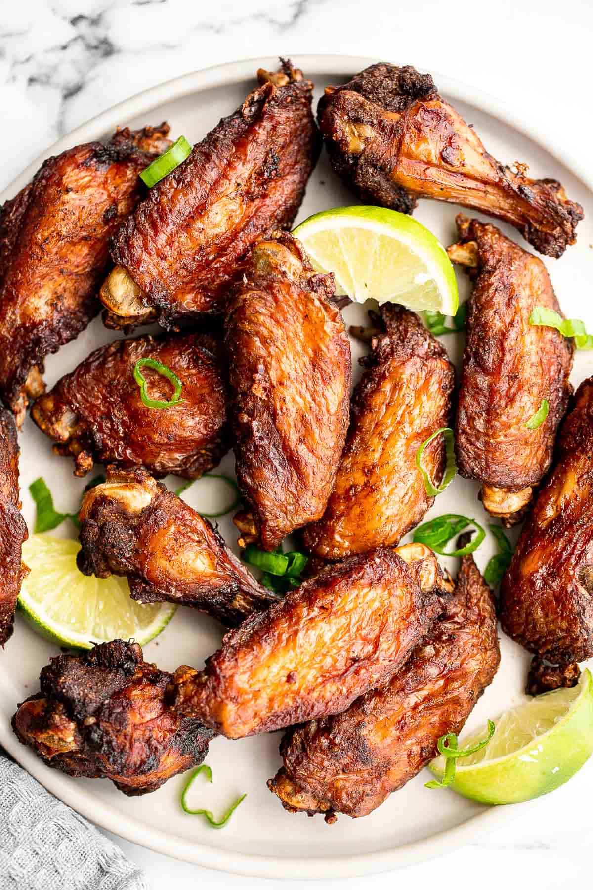 Jamaican jerk chicken wings with delicious crispy skin and tender and juicy meat are loaded with flavor. They're easy to make on the oven, grill, air fryer. | aheadofthyme.com