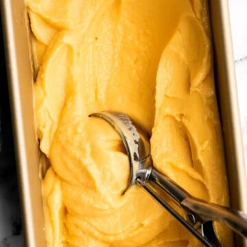 Mango frozen yogurt is a healthy, creamy, fruity, and refreshing frozen treat that's easy to make in minutes with a few ingredients and no refined sugar. | aheadofthyme.com