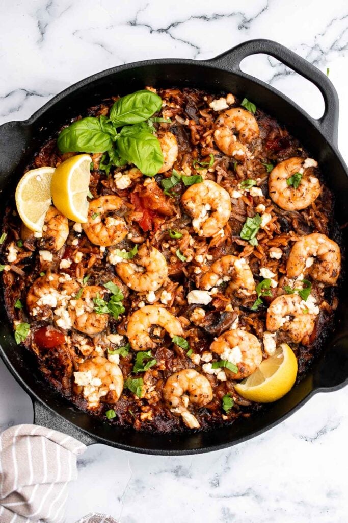 Mediterranean baked shrimp orzo is a complete wholesome one pot meal with delicious sautéed vegetables, juicy shrimp, and orzo pasta. Make it in 30 minutes. | aheadofthyme.com