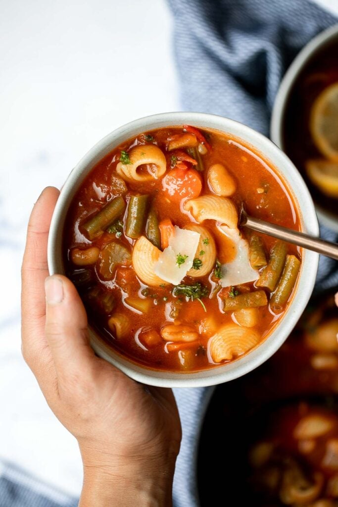 Minestrone soup is a hearty, healthy, nourishing, and delicious classic Italian soup, packed with vegetables and pasta simmered in a rich tomato broth. | aheadofthyme.com