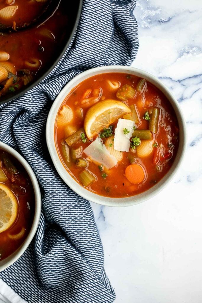 Minestrone soup is a hearty, healthy, nourishing, and delicious classic Italian soup, packed with vegetables and pasta simmered in a rich tomato broth. | aheadofthyme.com