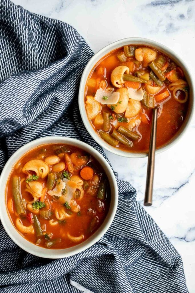 Minestrone soup is a hearty, healthy, nourishing, and delicious classic Italian soup, packed with vegetables and pasta simmered in a rich tomato broth. | aheadofthyme.com