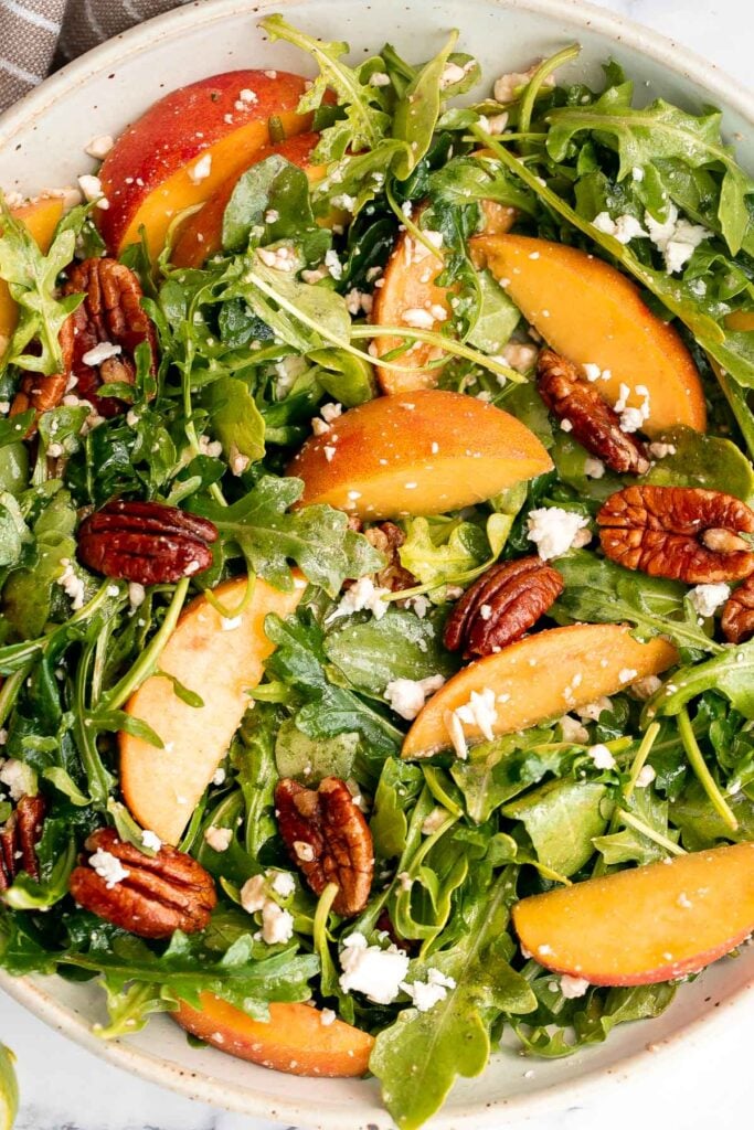 Peach arugula salad with balsamic vinaigrette is an easy delicious summer salad made with a handful of simple ingredients that packs on lots of flavor. | aheadofthyme.com